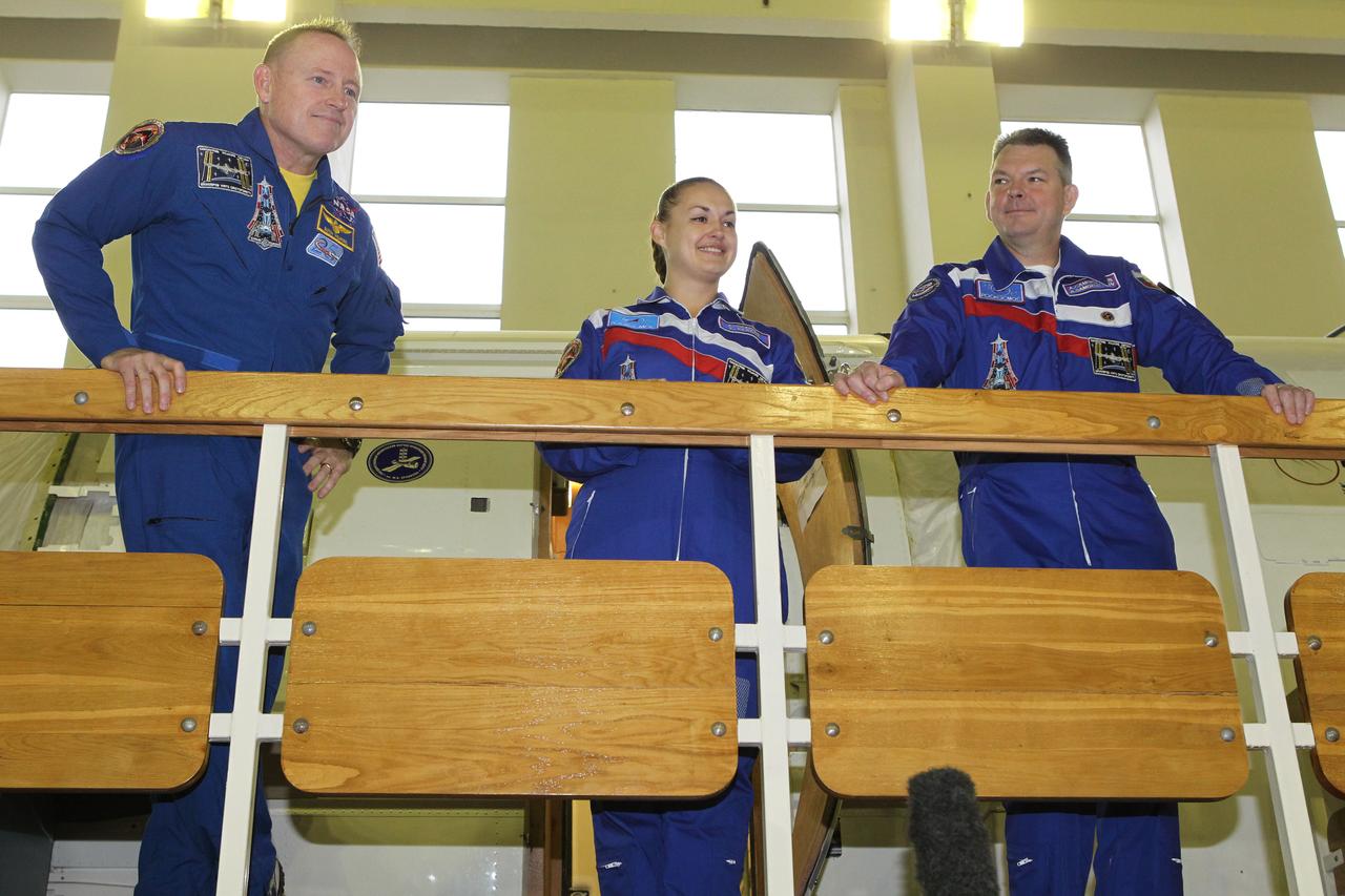 1929:  At the Gagarin Cosmonaut Training Center in Star City, Russia, Expedition 41/42 prime crewmembers Barry Wilmore of NASA (left), Elena Serova of the Russian Federal Space Agency (Roscosmos, center) and Alexander Samokutyaev of Roscosmos (right) pose for pictures and answer reporters’ questions September 3 at the start of final qualification exams. They will launch September 26 from the Baikonur Cosmodrome in Kazakhstan, Kazakh time, in the Soyuz TMA-14M spacecraft for a 5 ½ month mission on the International Space Station. Serova will become only the fourth Russian woman to fly in space and the first Russian woman to conduct a long duration mission on the station.  NASA/Stephanie Stoll 