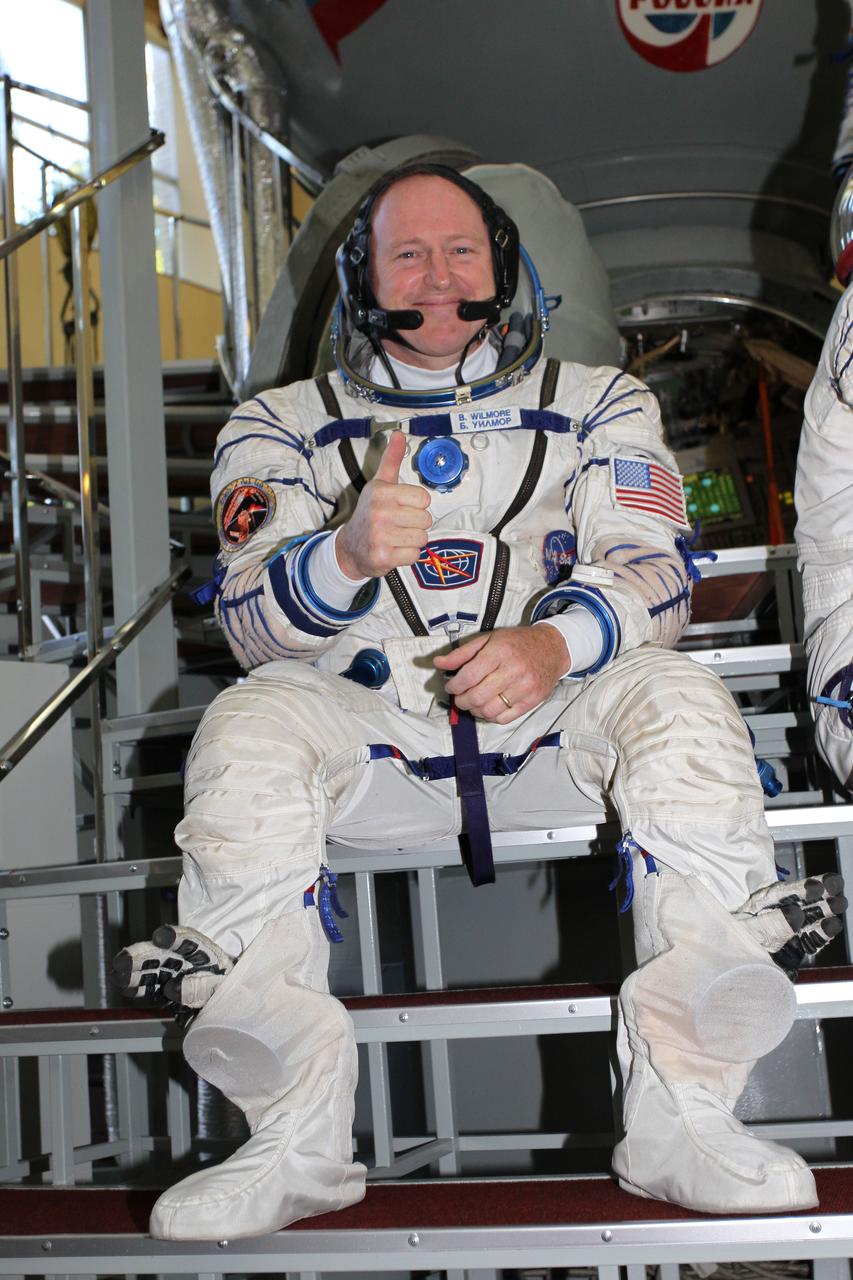 2112:  At the Gagarin Cosmonaut Training Center in Star City, Russia, Expedition 41/42 Flight Engineer Barry Wilmore of NASA flashes a thumbs up sign September 4 at the start of the second day of final qualification exams. Wilmore, Soyuz Commander Alexander Samokutyaev of the Russian Federal Space Agency (Roscosmos) and Flight Engineer Elena Serova of Roscosmos will launch from the Baikonur Cosmodrome in Kazakhstan, Sept. 26, Kazakh time, in their Soyuz TMA-14M spacecraft for a 5 ½ month mission on the International Space Station. Serova will become the fourth Russian woman to fly in space and the first Russian woman to conduct a long duration mission on the station.  NASA/Stephanie Stoll 