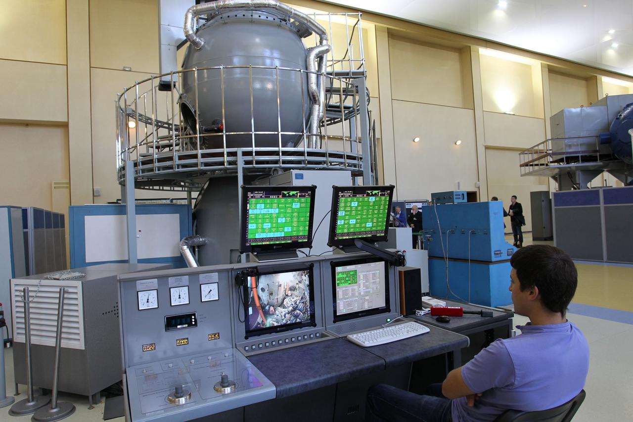 2130:  At the Gagarin Cosmonaut Training Center in Star City, Russia, a trainer keeps an eye on monitors as the Expedition 41/42 crew --- Barry Wilmore of NASA and Alexander Samokutyaev and Elena Serova of the Russian Federal Space Agency (Roscosmos) --- conduct a qualification exam run in a nearby Soyuz spacecraft simulator. Wilmore, Samokutyaev and Serova will launch from the Baikonur Cosmodrome in Kazakhstan, Sept. 26, Kazakh time, in their Soyuz TMA-14M spacecraft for a 5 ½ month mission on the International Space Station. Serova will become the fourth Russian woman to fly in space and the first Russian woman to conduct a long duration mission on the station.  NASA/Stephanie Stoll 