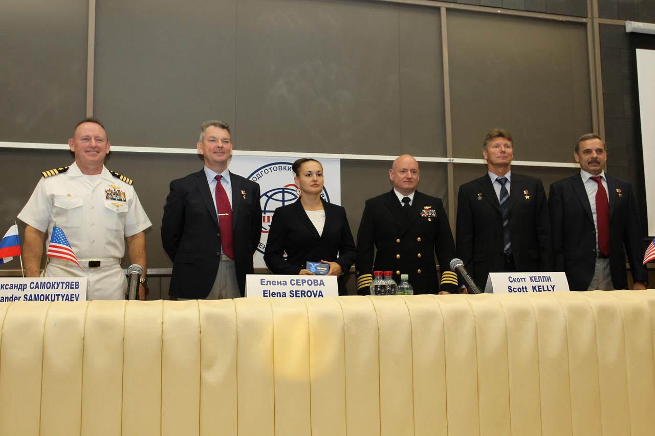 2290:  At the Gagarin Cosmonaut Training Center in Star City, Russia, the Expedition 41/42 prime and backup crews are introduced to the media Sept. 5 at a crew news conference. From left to right are prime crewmembers Barry Wilmore of NASA, Soyuz Commander Alexander Samokutyaev of the Russian Federal Space Agency (Roscosmos) and Elena Serova of Roscosmos, and backup crewmembers Scott Kelly of NASA, Gennady Padalka of Roscosmos and Mikhail Kornienko of Roscosmos. Wilmore, Samokutyaev and Serova will launch from the Baikonur Cosmodrome in Kazakhstan on Sept. 26, Kazakh time, in their Soyuz TMA-14M spacecraft for a 5 ½ month mission on the International Space Station. Serova will become the fourth Russian woman to fly in space and the first Russian woman to conduct a long duration mission on the station. Kelly and Kornienko will launch in March 2015 to spend a full year on the complex.  NASA/Stephanie Stoll 