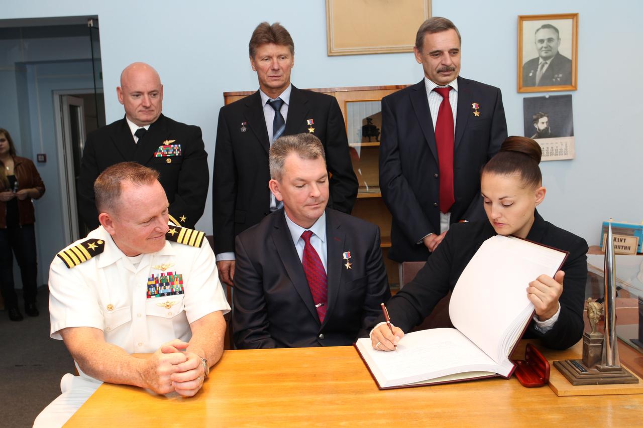 2372:  At the Gagarin Cosmonaut Training Center in Star City, Russia, Expedition 41/42 Flight Engineer Elena Serova of the Russian Federal Space Agency (Roscosmos, front row, right) signs a welcome book at the Gagarin Museum Sept. 5 in a traditional ceremony as her crewmates, Soyuz Commander Alexander Samokutyaev of Roscosmos (front row, center) and NASA’s Barry Wilmore (front row, left) look on. In the back row are their backups, NASA’s Scott Kelly (back row, left), Gennady Padalka of Roscosmos (back row, center) and Mikhail Kornienko of Roscosmos (back row, right). Wilmore, Samokutyaev and Serova will launch from the Baikonur Cosmodrome in Kazakhstan on Sept. 26, Kazakh time, in their Soyuz TMA-14M spacecraft for a 5 ½ month mission on the International Space Station. Serova will become the fourth Russian woman to fly in space and the first Russian woman to conduct a long duration mission on the station. Kelly and Kornienko will launch in March 2015 to spend a full year on the complex.  NASA/Stephanie Stoll 