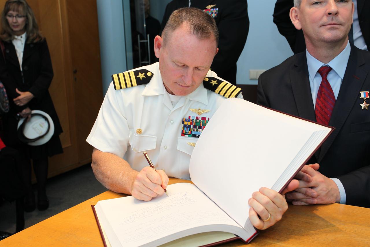 2381:  At the Gagarin Cosmonaut Training Center in Star City, Russia, Expedition 41/42 Flight Engineer Barry Wilmore of NASA signs a welcome book at the Gagarin Museum Sept. 5 in a traditional ceremony. Wilmore, Elena Serova of the Russian Federal Space Agency (Roscosmos) and Soyuz Commander Alexander Samokutyaev of Roscosmos (right) will launch from the Baikonur Cosmodrome in Kazakhstan on Sept. 26, Kazakh time, in their Soyuz TMA-14M spacecraft for a 5 ½ month mission on the International Space Station. Serova will become the fourth Russian woman to fly in space and the first Russian woman to conduct a long duration mission on the station.   NASA/Stephanie Stoll 