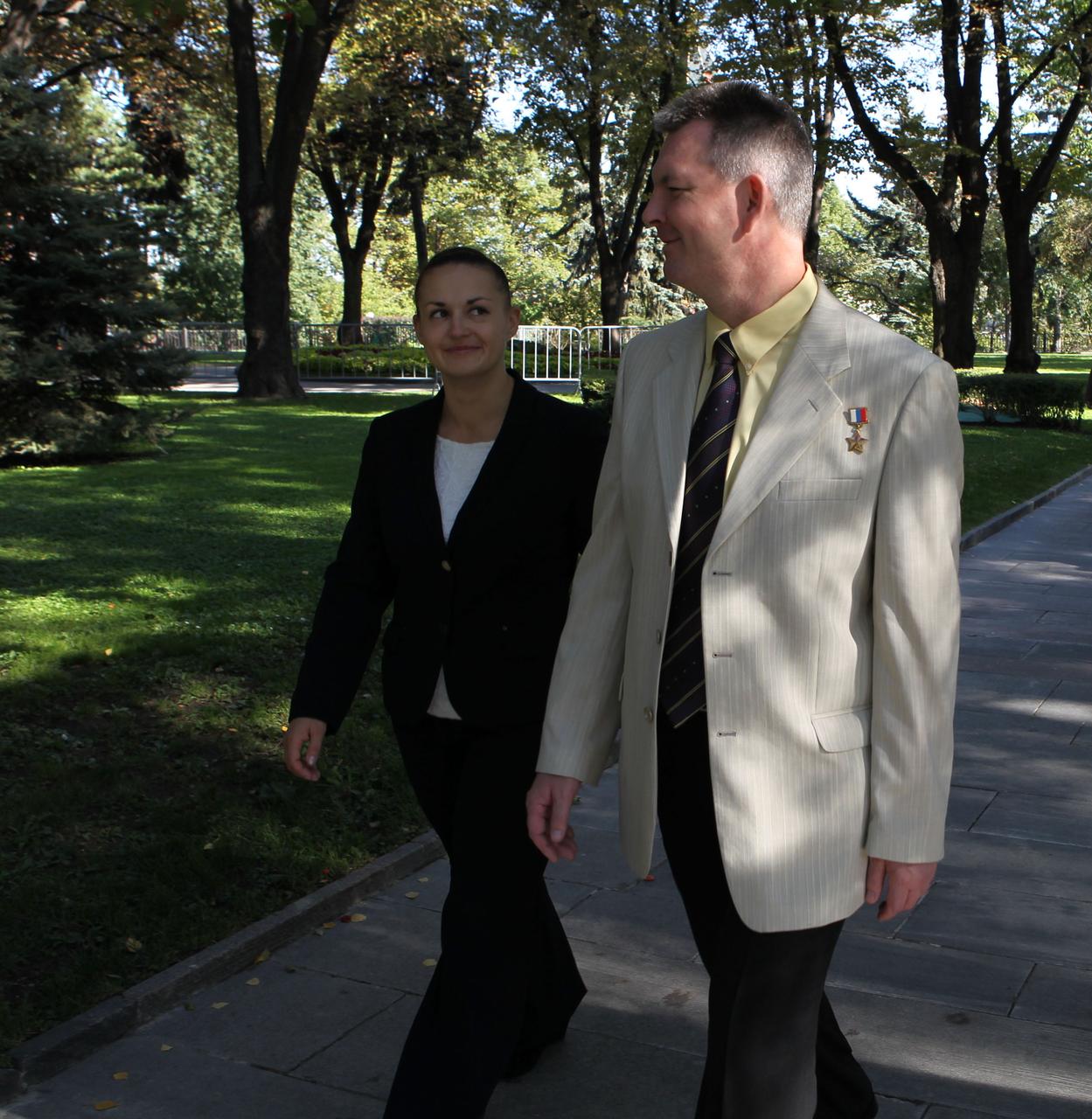 2722a:  Expedition 41/42 Flight Engineer Elena Serova of the Russian Federal Space Agency (Roscosmos, left) and Soyuz Commander Alexander Samokutyaev of Roscosmos (right) stroll through the Kremlin grounds in Moscow Sept. 5 after laying flowers at the site where Russian space icons are interred in a traditional ceremony. Serova, Samokutyaev and NASA Flight Engineer Barry Wilmore will launch from the Baikonur Cosmodrome in Kazakhstan on Sept. 26, Kazakh time, in their Soyuz TMA-14M spacecraft for a 5 ½ month mission on the International Space Station. Serova will become the fourth Russian woman to fly in space and the first Russian woman to conduct a long duration mission on the station.   NASA/Stephanie Stoll 