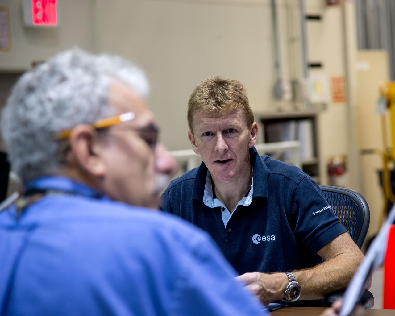 PHOTO DATE:  09-08-14 LOCATION:  Building 16N/1040 - SES Alpha-Cupola  SUBJECT: ESA Astronaut Timothy Peake on behalf of ESA prior to FF RNDZ ADV 3 training with Kopra and Wilmore. PHOTOGRAPHER: BILL STAFFORD