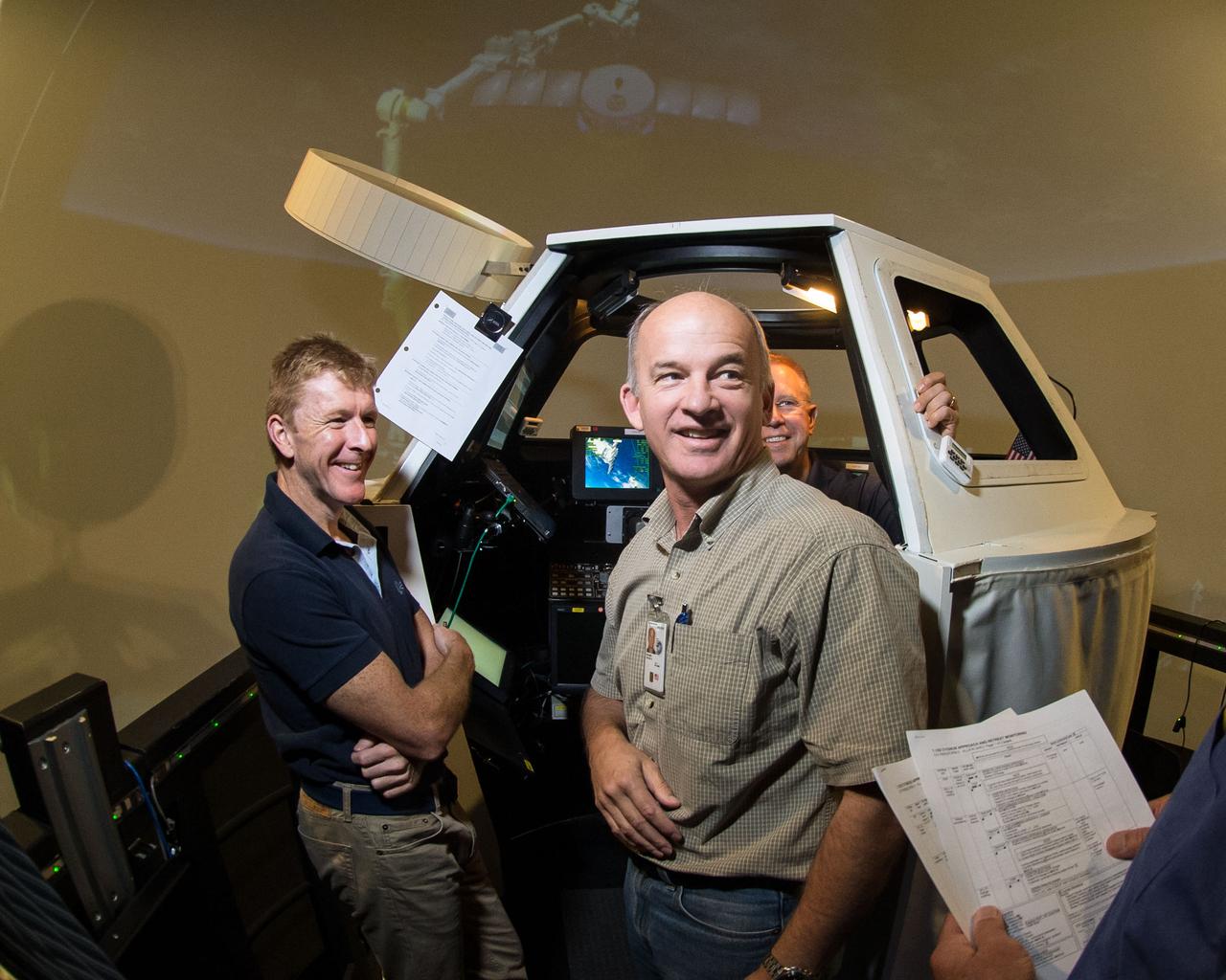 PHOTO DATE:  09-08-14 LOCATION:  Building 16N/1040 - SES Alpha-Cupola  SUBJECT: ESA Astronaut Timothy Peake on behalf of ESA prior to FF RNDZ ADV 3 training with Kopra and Wilmore. PHOTOGRAPHER: BILL STAFFORD