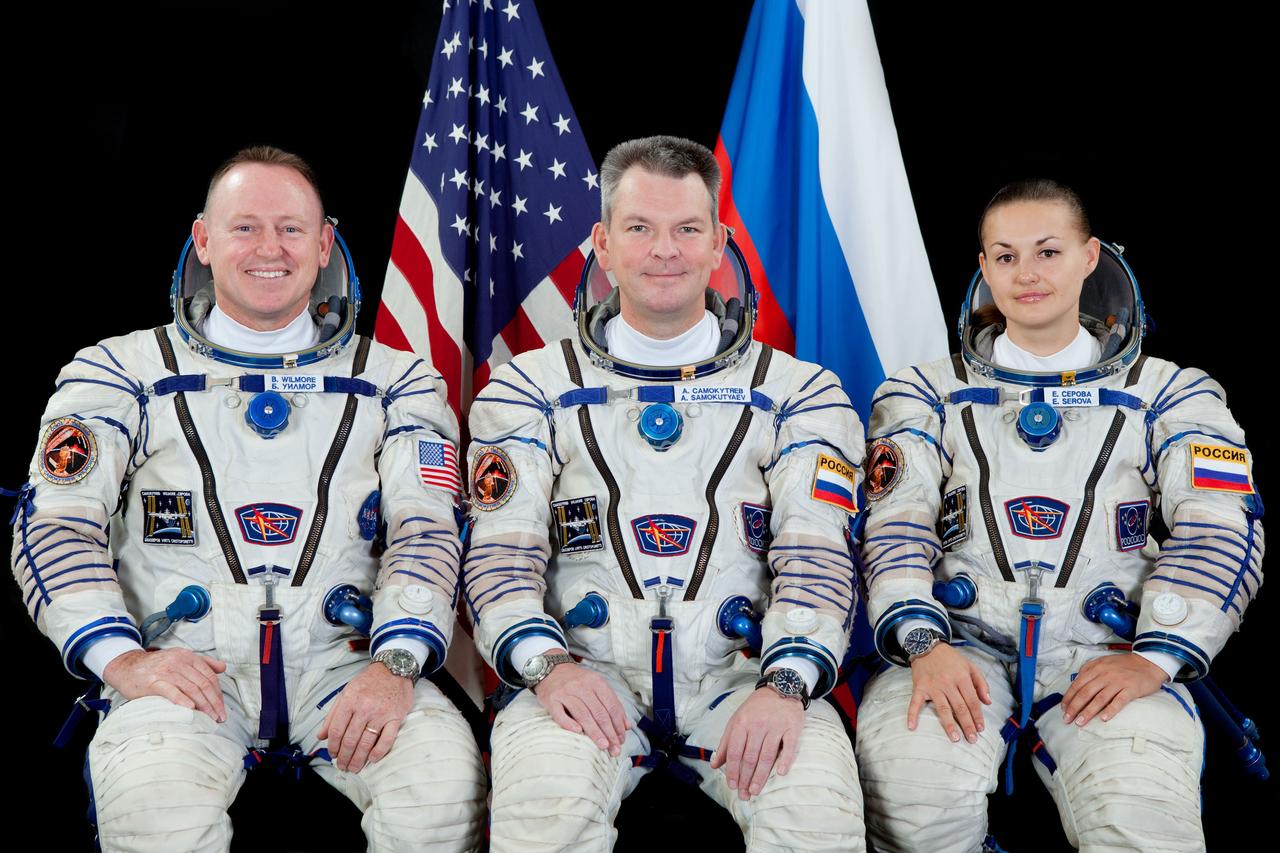 JSC2014-E-079951 (19 June 2014) --- NASA astronaut Barry Wilmore (left), Expedition 41 flight engineer and Expedition 42 commander; Russian cosmonauts Alexander Samokutyaev and Elena Serova, both Expedition 41/42 flight engineers, attired in Russian Sokol launch and entry suits, take a break from training in Star City, Russia to pose for a portrait. Photo credit: Gagarin Cosmonaut Training Center