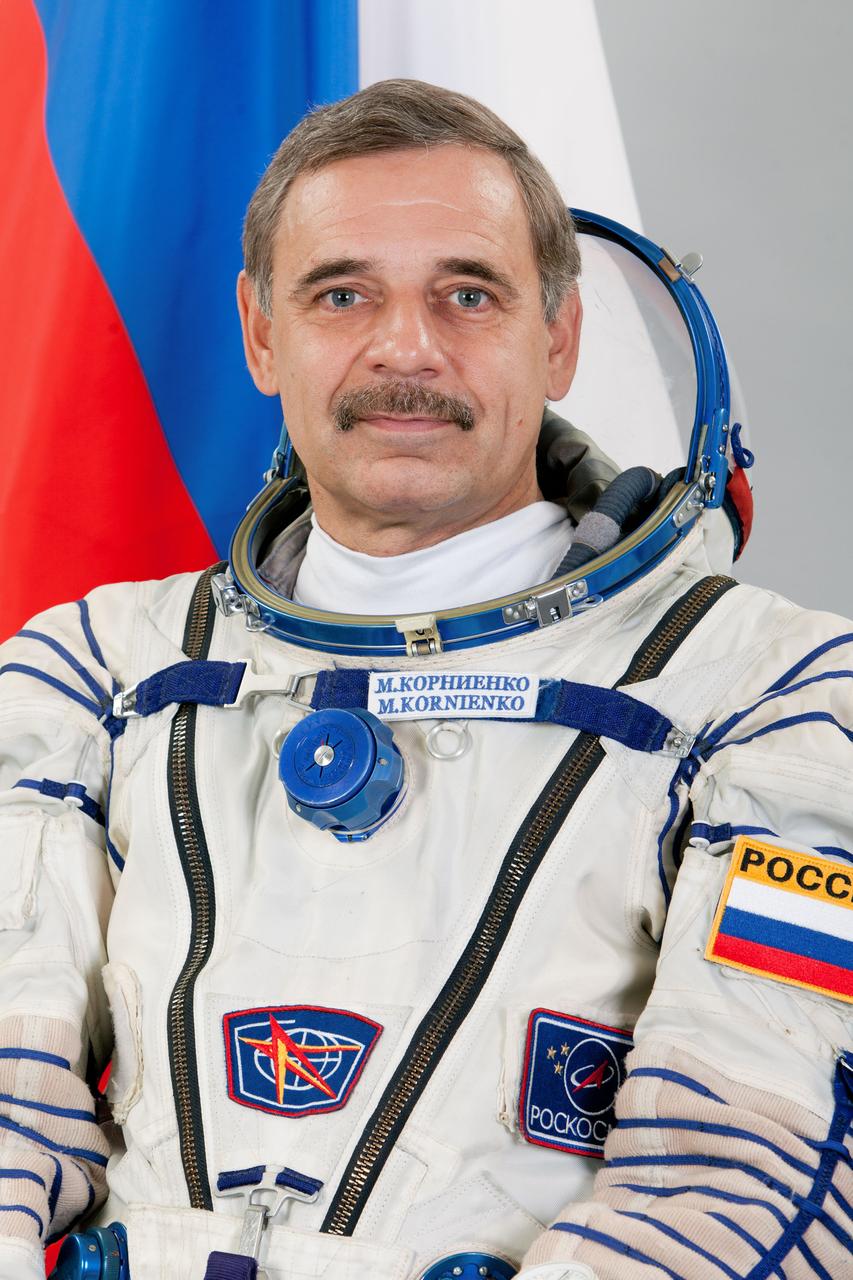 JSC2014-E-079955 (27 May 2014) --- Russian cosmonaut Mikhail Kornienko, Expedition 41 backup crew member, attired in a Russian Sokol launch and entry suit, takes a break from training in Star City, Russia to pose for a portrait. Photo credit: Gagarin Cosmonaut Training Center