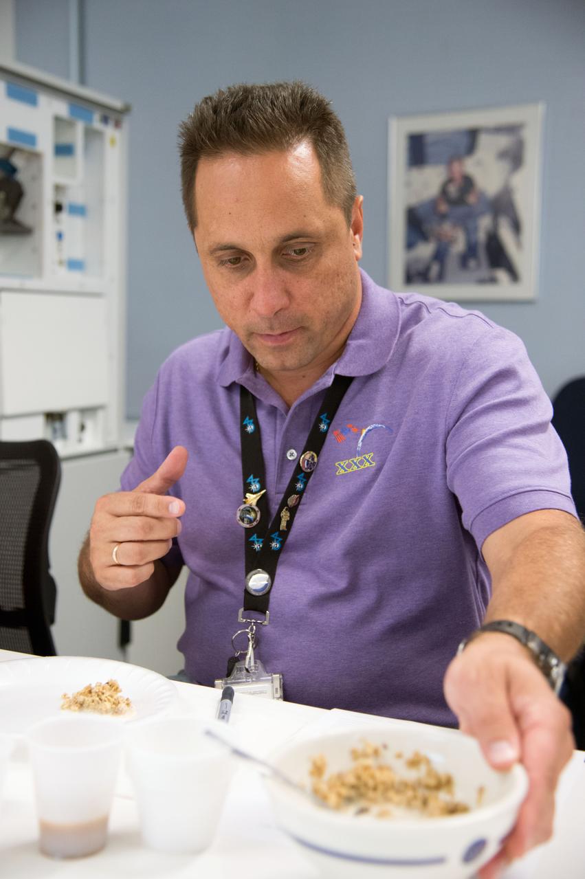 Date: 09-10-14 Location: Bldg 17, Food Lab Subject: Soyuz 44 crew member and cosmonauts Sergei Volkov and Anton Shkaplerov during food tasting in JSC Food Lab Photographer: James Blair
