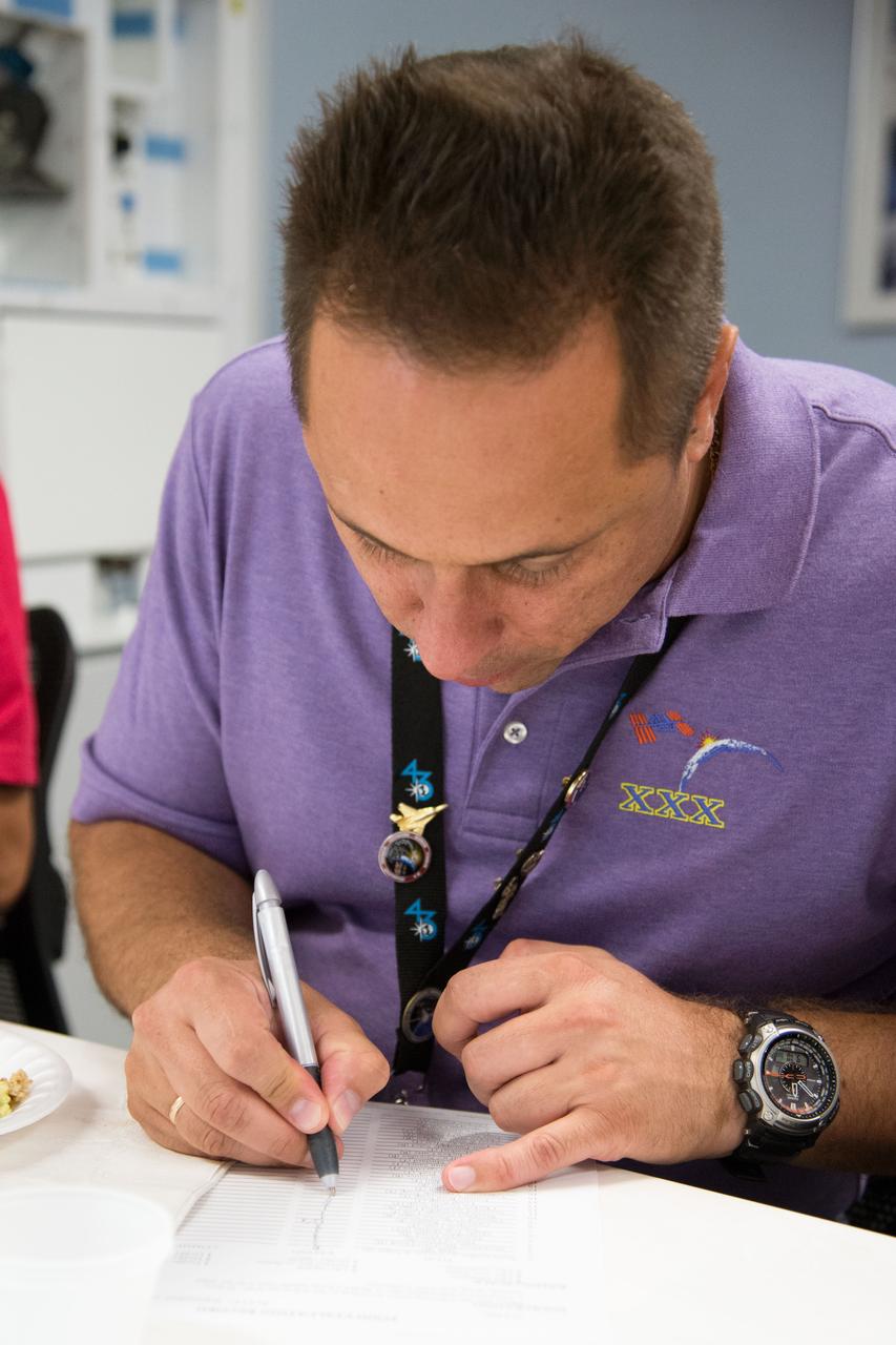 Date: 09-10-14 Location: Bldg 17, Food Lab Subject: Soyuz 44 crew member and cosmonauts Sergei Volkov and Anton Shkaplerov during food tasting in JSC Food Lab Photographer: James Blair