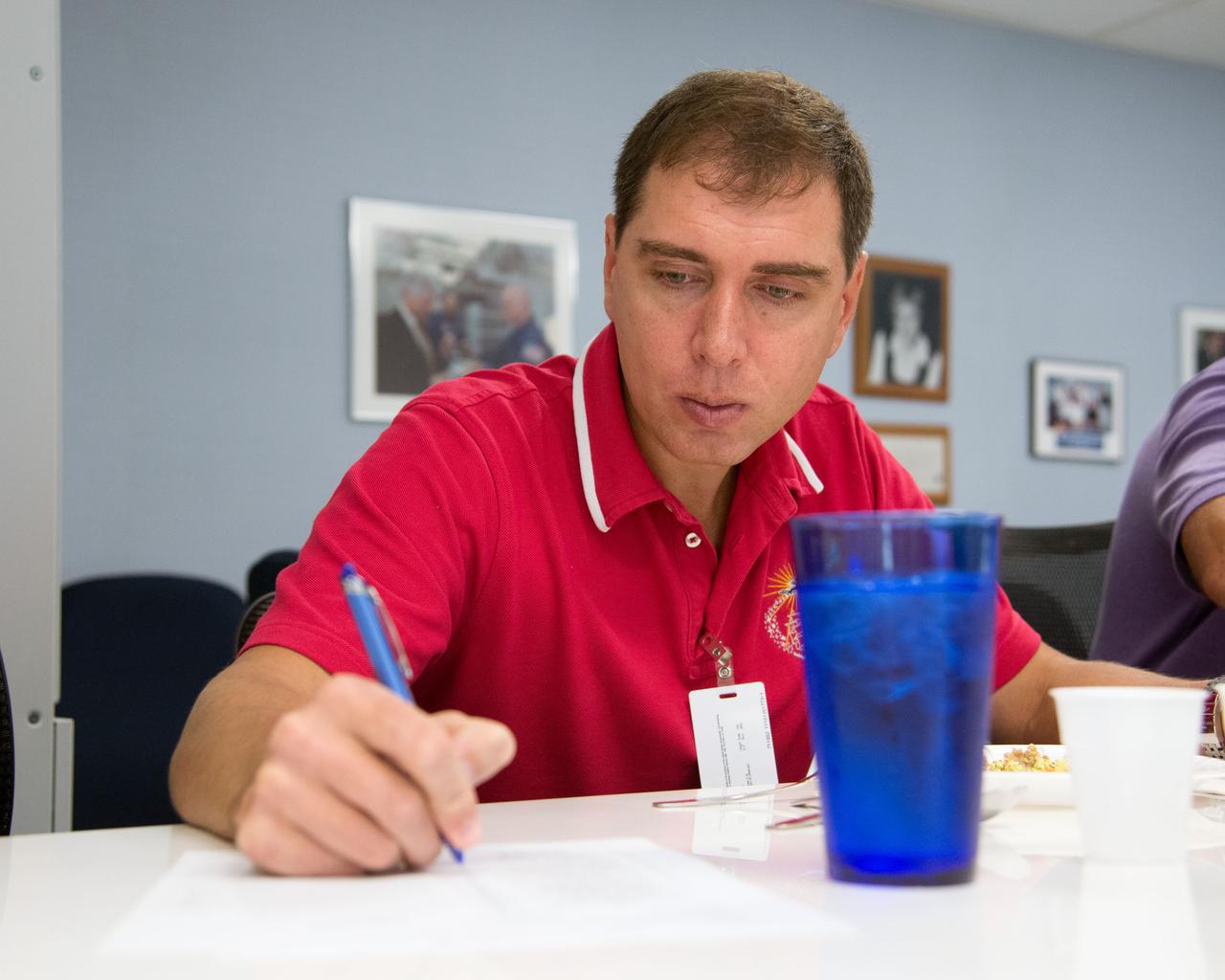 Date: 09-10-14 Location: Bldg 17, Food Lab Subject: Soyuz 44 crew member and cosmonauts Sergei Volkov and Anton Shkaplerov during food tasting in JSC Food Lab Photographer: James Blair