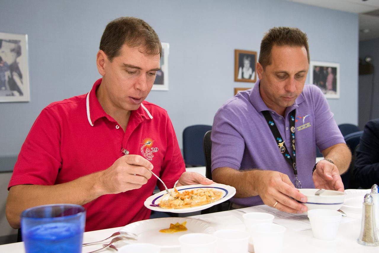 Date: 09-10-14 Location: Bldg 17, Food Lab Subject: Soyuz 44 crew member and cosmonauts Sergei Volkov and Anton Shkaplerov during food tasting in JSC Food Lab Photographer: James Blair