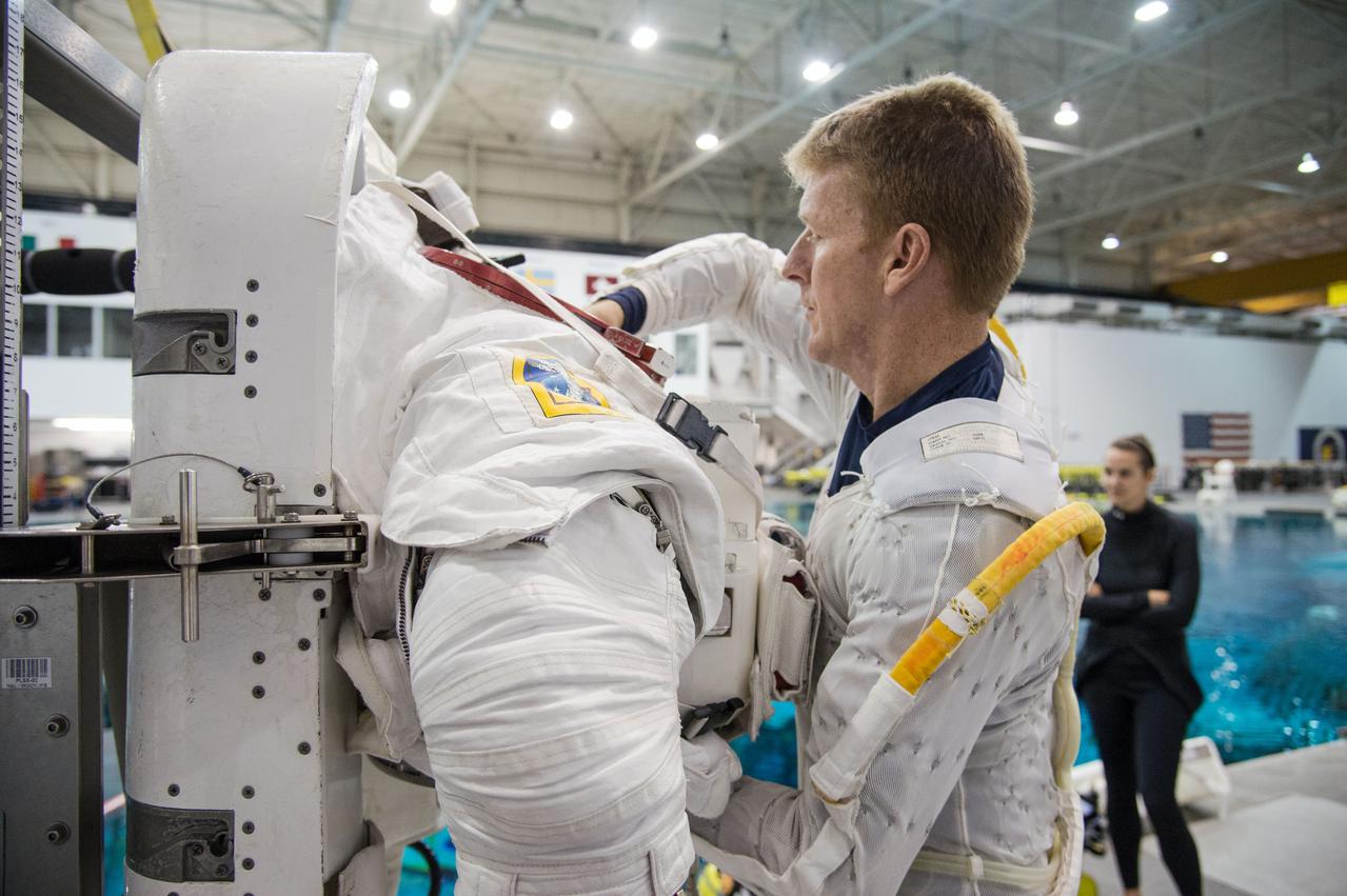 European Astronaut Tim Peake of ESA during ISS EVA MAINT 3 NBL Training with Astronaut Tim Kopra and instructor Sandy Moore. Photo Date: September 10, 2014. Location: NBL - Pool Topside. Photographer: Robert Markowitz