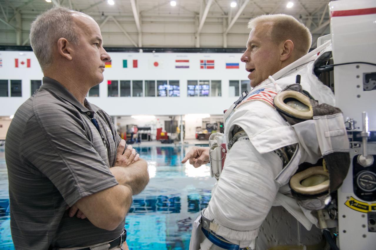 European Astronaut Tim Peake of ESA during ISS EVA MAINT 3 NBL Training with Astronaut Tim Kopra and instructor Sandy Moore. Photo Date: September 10, 2014. Location: NBL - Pool Topside. Photographer: Robert Markowitz