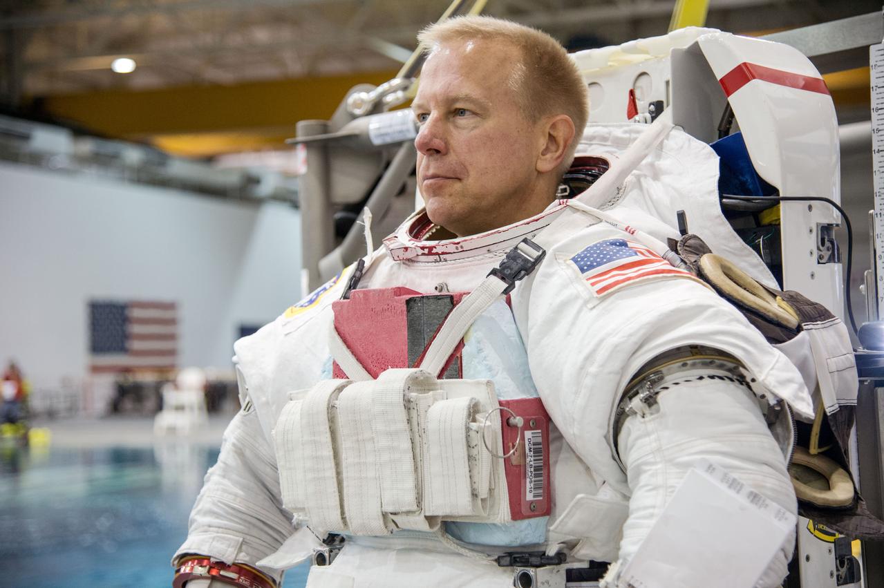 European Astronaut Tim Peake of ESA during ISS EVA MAINT 3 NBL Training with Astronaut Tim Kopra and instructor Sandy Moore.  Photo Date: September 10, 2014.  Location: NBL - Pool Topside.  Photographer: Robert Markowitz
