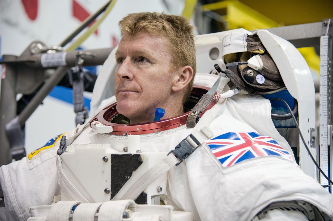 European Astronaut Tim Peake of ESA during ISS EVA MAINT 3 NBL Training with Astronaut Tim Kopra and instructor Sandy Moore.  Photo Date: September 10, 2014.  Location: NBL - Pool Topside.  Photographer: Robert Markowitz