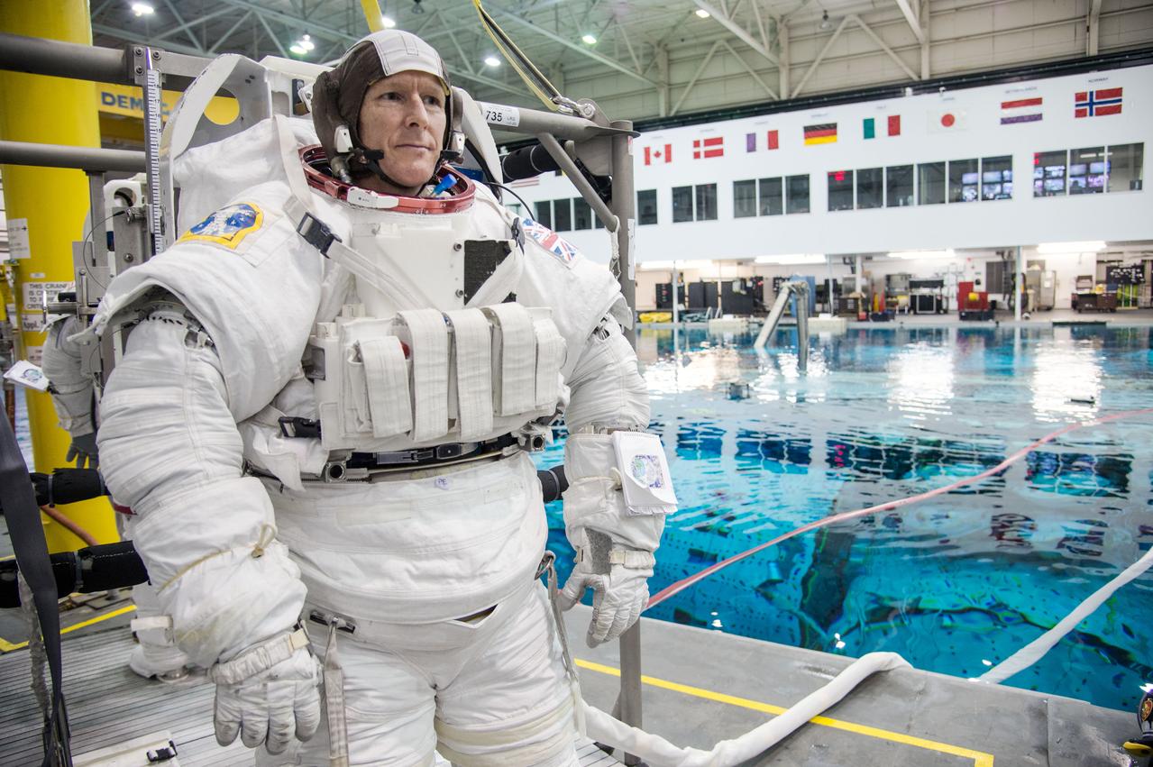 European Astronaut Tim Peake of ESA during ISS EVA MAINT 3 NBL Training with Astronaut Tim Kopra and instructor Sandy Moore.  Photo Date: September 10, 2014.  Location: NBL - Pool Topside.  Photographer: Robert Markowitz