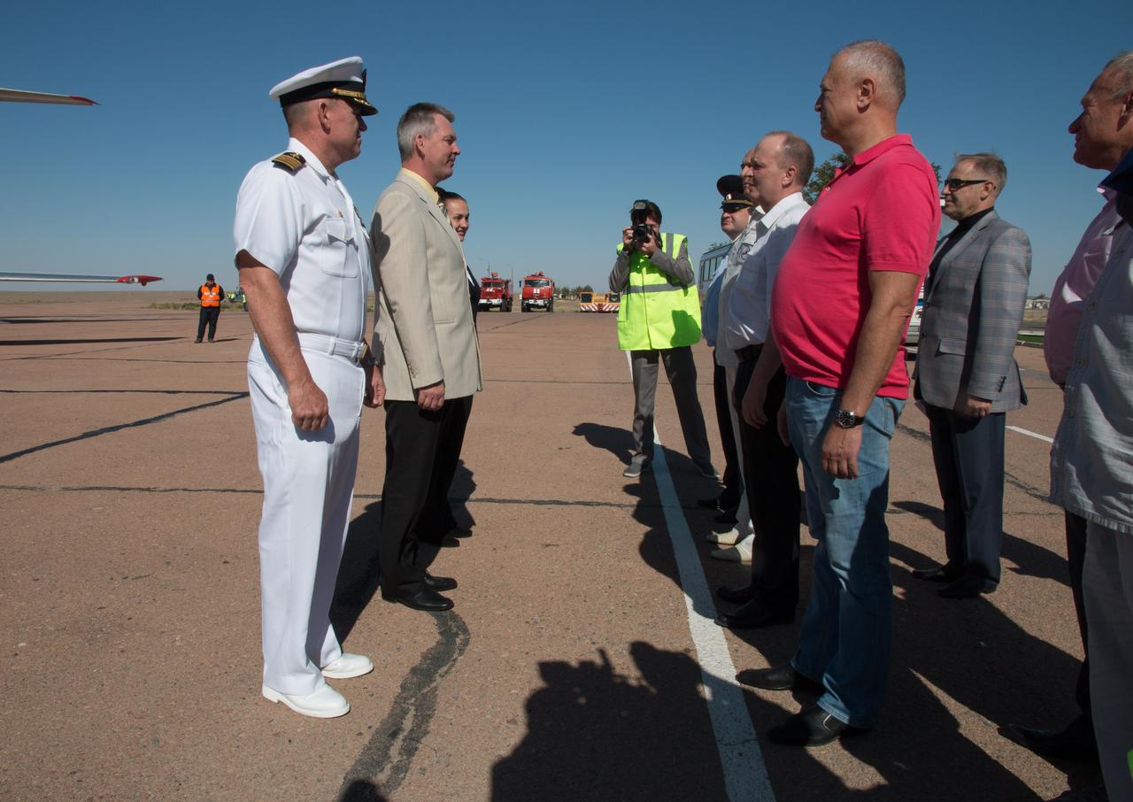 12-16-03-37-2: Expedition 41/42 Flight Engineer Barry Wilmore of NASA, Soyuz Commander Alexander Samokutyaev of the Russian Federal Space Agency (Roscosmos) and Flight Engineer Elena Serova of Roscosmos (all on the left) are greeted by Russian space officials after arriving at the launch site at the Baikonur Cosmodrome in Kazakhstan Sept. 12 for final pre-launch training. The trio will launch from Baikonur on Sept. 26, Kazakh time, in their Soyuz TMA-14M spacecraft for a 5 ½ month mission on the International Space Station. Serova will become the fourth Russian woman to fly in space. NASA/Victor Zelentsov