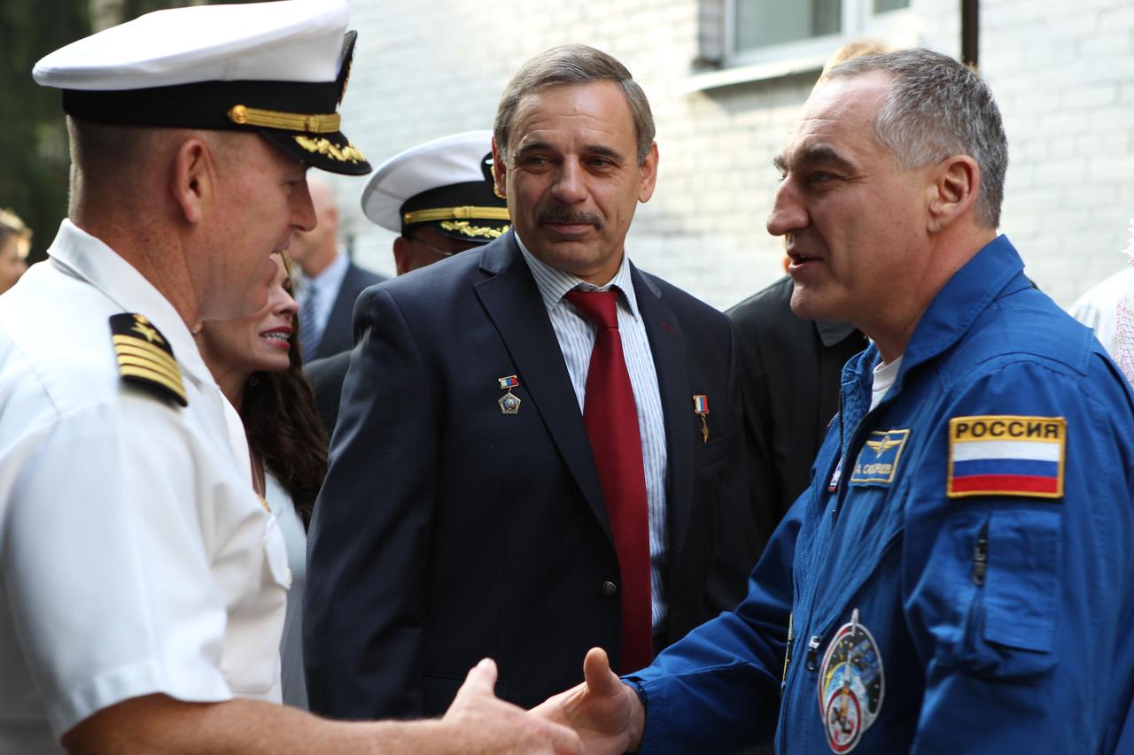 2950:  At the Gagarin Cosmonaut Training Center in Star City, Russia, Expedition 41/42 Flight Engineer Barry Wilmore of NASA (left) greets Expedition 40 Soyuz Commander Alexander Skvortsov of the Russian Federal Space Agency (Roscosmos, right) Sept. 12, just one day after Skvortsov returned home from the International Space Station to complete 169 days in space. Looking on is Expedition 41/42 backup crewmember Mikhail Kornienko of Roscosmos (center), who will launch to the station in March 2015 to spend a full year in space with NASA’s Scott Kelly. Wilmore, Alexander Samokutyaev of Roscosmos and Elena Serova of Roscosmos will launch from Baikonur on Sept. 26, Kazakh time, in their Soyuz TMA-14M spacecraft for a 5 ½ month mission on the International Space Station. Serova will become the fourth Russian woman to fly in space.  NASA/Stephanie Stoll 
