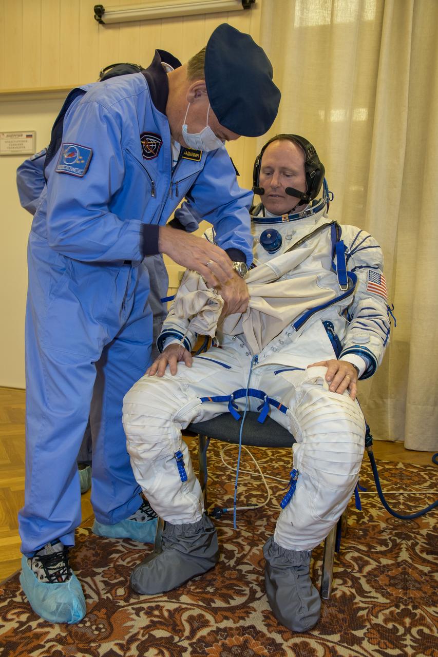 13-12-18-49: (13 Sept. 2014) --- At the Baikonur Cosmodrome in Kazakhstan, Expedition 41/42 Flight Engineer Barry Wilmore of NASA suits up in his Russian Sokol launch and entry suit Sept. 13 during the first of two “fit check” dress rehearsal activities. Wilmore, Soyuz Commander Alexander Samokutyaev of the Russian Federal Space Agency (Roscosmos) and Flight Engineer Elena Serova of Roscosmos will launch on Sept. 26, Kazakh time, in the Soyuz TMA-14M spacecraft to begin a 5 ½ month mission on the International Space Station. Serova will become the fourth Russian woman to fly in space. Photo credit: NASA/Victor Zelentsov