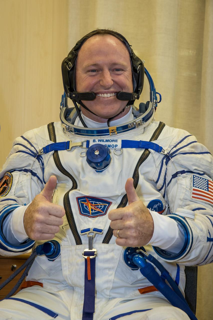13-12-20-43:     (13 Sept. 2014) --- At the Baikonur Cosmodrome in Kazakhstan, Expedition 41/42 Flight Engineer Barry Wilmore of NASA flashes a thumbs up in his Russian Sokol launch and entry suit Sept. 13 during the first of two “fit check” dress rehearsal activities. Wilmore, Soyuz Commander Alexander Samokutyaev of the Russian Federal Space Agency (Roscosmos) and Flight Engineer Elena Serova of Roscosmos will launch on Sept. 26, Kazakh time, in the Soyuz TMA-14 spacecraft to begin a 5 ½ month mission on the International Space Station. Serova will become the fourth Russian woman to fly in space. Photo credit: NASA/Victor Zelentsov