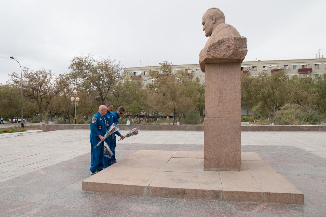 14-12-25-10-2:     (14 Sept. 2014) --- The Expedition 41/42 backup crew  members lay flowers in homage to Russian space icon Sergei Korolev at his statue during a tour of Baikonur, Kazakhstan Sept. 14. From left to right are Scott Kelly of NASA, Gennady Padalka of the Russian Federal Space Agency (Roscosmos) and Mikhail Kornienko of Roscosmos. Kelly and Kornienko will launch from Baikonur in March 2015 to spend a full year on the International Space Station. They are backups to Barry Wilmore of NASA, Alexander Samokutyaev of the Russian Federal Space Agency (Roscosmos) and Elena Serova of Roscosmos. Wilmore, Samokutyaev and Serova will launch on Sept. 26, Kazakh time, in the Soyuz TMA-14M spacecraft to begin a 5 ½ month mission on the station. Serova will become the fourth Russian woman to fly in space.  Photo credit: NASA/Victor Zelentsov
