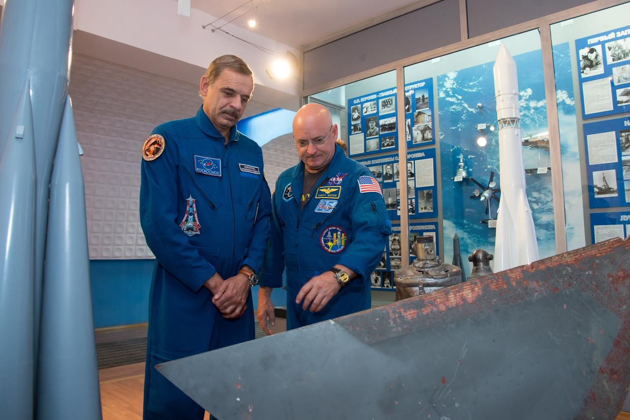 14-12-44-12-3:     (14 Sept. 2014) --- Expedition 41/42 backup crewmembers Mikhail Kornienko of the Russian Federal Space Agency (Roscosmos, left) and NASA’s Scott Kelly (right) take a look at space memorabilia during a tour of a space museum in Baikonur, Kazakhstan Sept. 14. Kelly and Kornienko will launch from Baikonur in March 2015 to spend a full year on the International Space Station. They are backups to Barry Wilmore of NASA, Alexander Samokutyaev of the Russian Federal Space Agency (Roscosmos) and Elena Serova of Roscosmos. Wilmore, Samokutyaev and Serova will launch on Sept. 26, Kazakh time, in the Soyuz TMA-14M spacecraft to begin a 5 ½ month mission on the station. Serova will become the fourth Russian woman to fly in space.  Photo credit: NASA/Victor Zelentsov