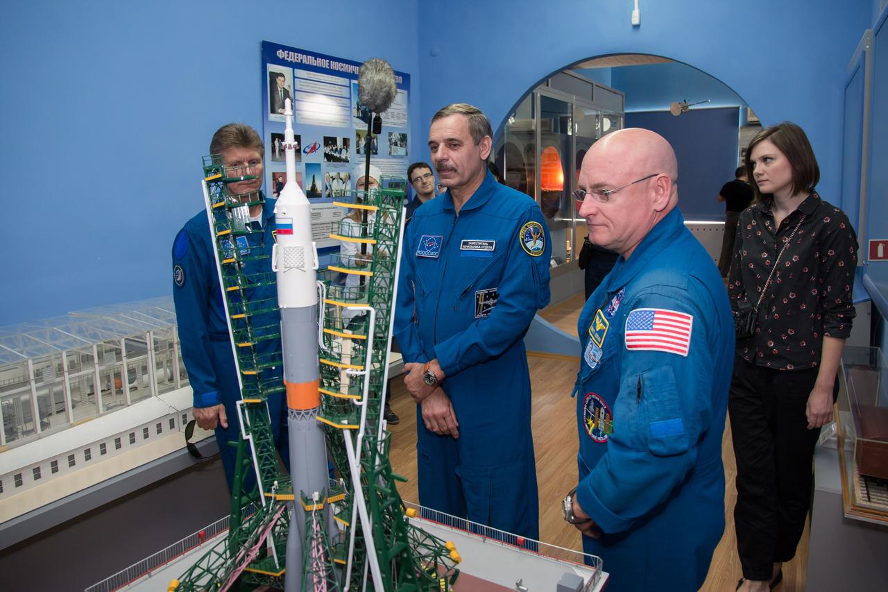 14-12-50-36-2: (14 Sept. 2014) --- Expedition 41/42 backup crewmembers Gennady Padalka of the Russian Federal Space Agency (Roscosmos, left), Mikhail Kornienko of Roscosmos (center) and NASA’s Scott Kelly (right) take a look at a model of a Soyuz rocket during a tour of a space museum in Baikonur, Kazakhstan Sept. 14. Kelly and Kornienko will launch from Baikonur in March 2015 to spend a full year on the International Space Station. They are backups to Barry Wilmore of NASA, Alexander Samokutyaev of the Russian Federal Space Agency (Roscosmos) and Elena Serova of Roscosmos. Wilmore, Samokutyaev and Serova will launch on Sept. 26, Kazakh time, in the Soyuz TMA-14M spacecraft to begin a 5 ½ month mission on the station. Serova will become the fourth Russian woman to fly in space. NASA/Victor Zelentsov
