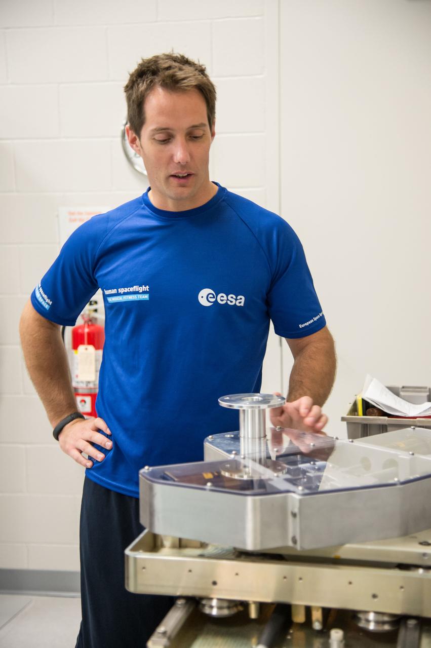 ESA Astronaut Thomas Pesquet during CMS ARED OPS training with instructor Kimberlee Jadwick .  Photo Date: September 16, 2014.  Location: Building 26.  Photographer: Robert Markowitz