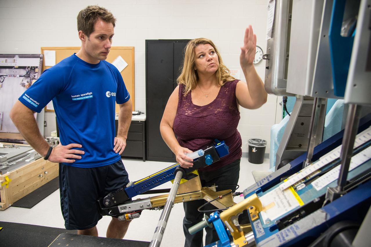 ESA Astronaut Thomas Pesquet during CMS ARED OPS training with instructor Kimberlee Jadwick .  Photo Date: September 16, 2014.  Location: Building 26.  Photographer: Robert Markowitz