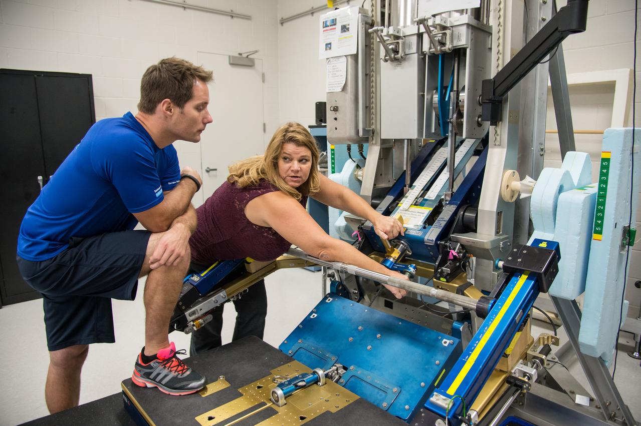 ESA Astronaut Thomas Pesquet during CMS ARED OPS training with instructor Kimberlee Jadwick .  Photo Date: September 16, 2014.  Location: Building 26.  Photographer: Robert Markowitz