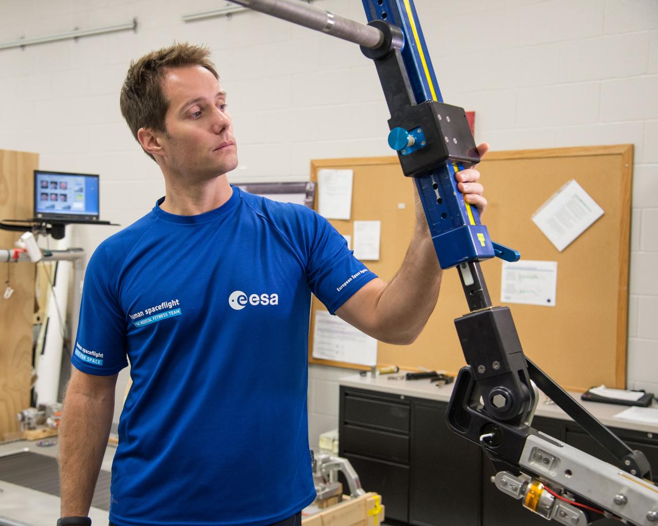 ESA Astronaut Thomas Pesquet during CMS ARED OPS training with instructor Kimberlee Jadwick .  Photo Date: September 16, 2014.  Location: Building 26.  Photographer: Robert Markowitz