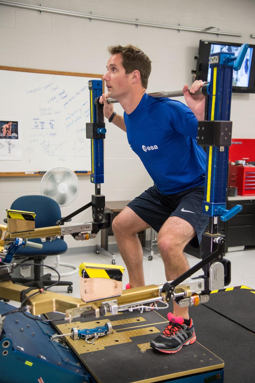 ESA Astronaut Thomas Pesquet during CMS ARED OPS training with instructor Kimberlee Jadwick .  Photo Date: September 16, 2014.  Location: Building 26.  Photographer: Robert Markowitz