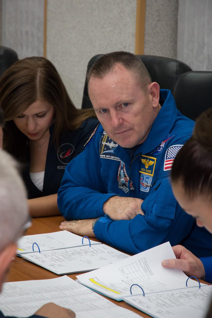 17-11-26-12:  (17 Sept. 2014) --- At the Cosmonaut Hotel crew quarters in Baikonur, Kazakhstan, Expedition 41 Flight Engineer Barry Wilmore looks on intently as he and his crewmates review flight procedures Sept. 17 for their upcoming launch. Wilmore, Flight Engineer Elena Serova of the Russian Federal Space Agency (Roscosmos) and Soyuz Commander Alexander Samokutyaev of Roscosmos will launch from the Baikonur Cosmodrome Sept. 26, Kazakh time, in the Soyuz TMA-14M spacecraft for a 5 ½ month mission on the International Space Station. Serova will become the fourth Russian woman to fly in space and the first Russian woman to live and work on the station.  Photo credit: NASA/Victor Zelentsov 