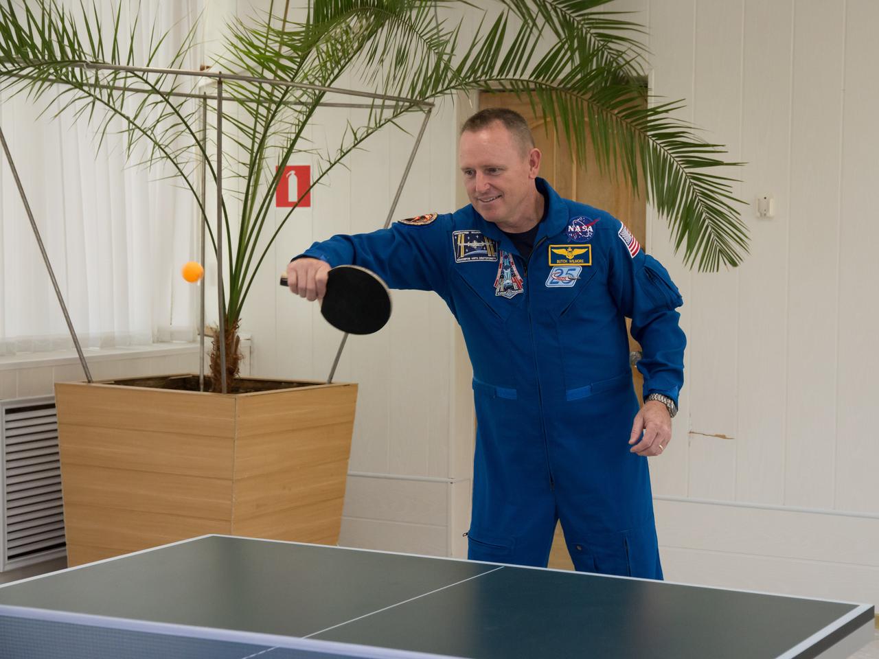 17-12-00-2:  (17 Sept. 2014) --- At the Cosmonaut Hotel crew quarters in Baikonur, Kazakhstan, Expedition 41 Flight Engineer Barry Wilmore of NASA  tries his hand at a game of table tennis Sept. 17 as he and his crewmates prepare for their upcoming launch. Wilmore,  Soyuz Commander Alexander Samokutyaev of the Russian Federal Space Agency (Roscosmos) and Flight Engineer Elena Serova of Roscosmos will launch from the Baikonur Cosmodrome Sept. 26, Kazakh time, in the Soyuz TMA-14M spacecraft for a 5 ½ month mission on the International Space Station. Serova will become the fourth Russian woman to fly in space and the first Russian woman to live and work on the station.  Photo credit: NASA/Victor Zelentsov 