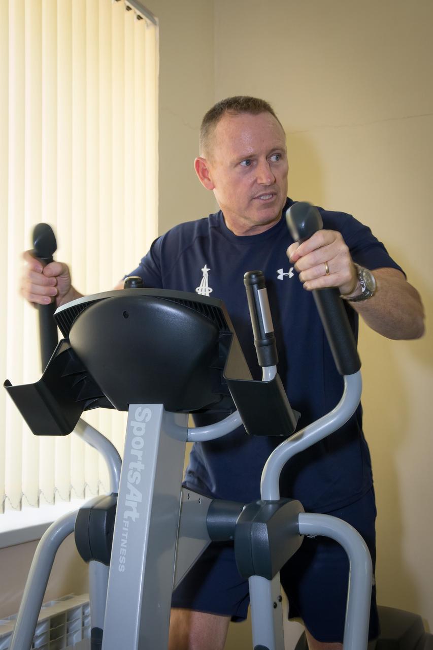 17-13-26-34:  (17 Sept. 2014) --- At the Cosmonaut Hotel crew quarters in Baikonur, Kazakhstan, Expedition 41 Flight Engineer Barry Wilmore of NASA  works out on exercise equipment Sept. 17 as he and his crewmates prepare for their upcoming launch. Wilmore,  Soyuz Commander Alexander Samokutyaev of the Russian Federal Space Agency (Roscosmos) and Flight Engineer Elena Serova of Roscosmos are scheduled to launch from the Baikonur Cosmodrome Sept. 26, Kazakh time, in the Soyuz TMA-14M spacecraft for a 5 ½ month mission on the International Space Station. Serova will become the fourth Russian woman to fly in space and the first Russian woman to live and work on the station.  Photo credit:  NASA/Victor Zelentsov 