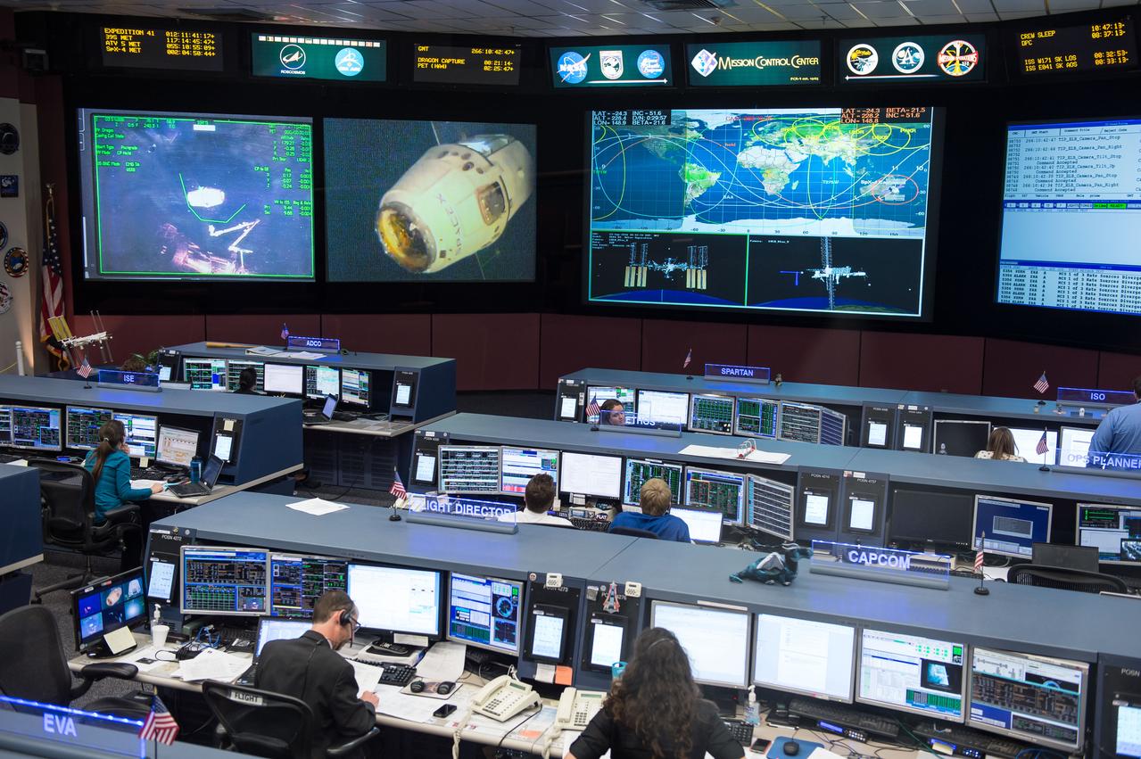 PHOTO DATE: 09/23/14 LOCATION: B30 MCC  SUBJECT: Expedition 41 Flight Controllers on Console in FCR-1 during SpaceX Dragon Capsule Grapple and Berthing. With Flight Director Chris Edelen.  PHOTOGRAPHER: REGAN GEESEMAN 