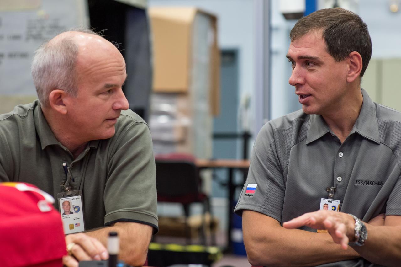 DATE: 9-22-14 LOCATION: Bldg 9NW - ISS Mockups. SUBJECT: Expedition 48 crew members (Soyuz 46) Aleksey Ovchinin, Oleg Skripochka and Jeff Williams during Emergency Scenarios Assigned 1 training in Space Vehicle Mockup Training Facilities (SVMTF) ISS mockups with instructor John Ray. PHOTOGRAPHER: Lauren Harnett