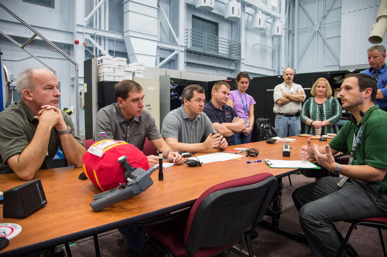 DATE: 9-22-14 LOCATION: Bldg 9NW - ISS Mockups. SUBJECT: Expedition 48 crew members (Soyuz 46) Aleksey Ovchinin, Oleg Skripochka and Jeff Williams during Emergency Scenarios Assigned 1 training in Space Vehicle Mockup Training Facilities (SVMTF) ISS mockups with instructor John Ray. PHOTOGRAPHER: Lauren Harnett