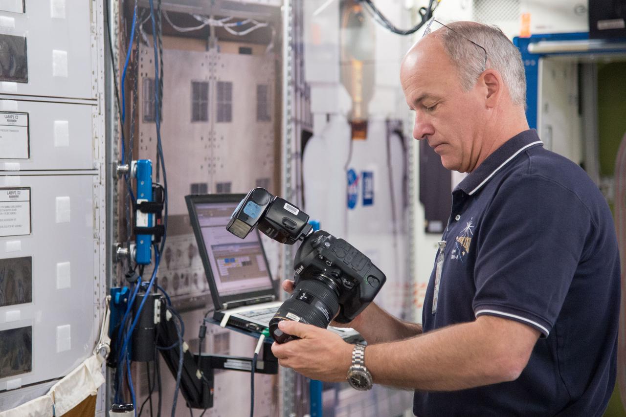 DATE: 9-24-14 LOCATION: Bldg. 9NW - ISS Mockups. SUBJECT: Expedition 48 crew members (Soyuz 46) Aleksey Ovchinin, Oleg Skripochka and Jeff Williams during Routine Ops training in Space Vehicle Mockup Training Facilities (SVMTF) ISS mockups with instructor John Ray. PHOTOGRAPHER: Lauren Harnett