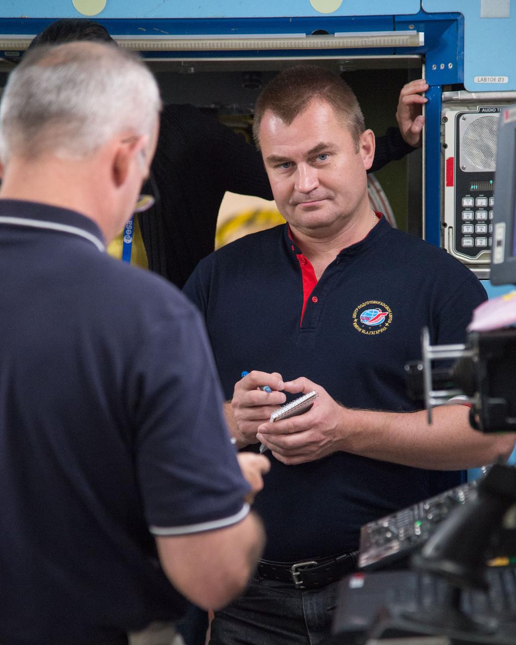 DATE: 9-24-14 LOCATION: Bldg. 9NW - ISS Mockups. SUBJECT: Expedition 48 crew members (Soyuz 46) Aleksey Ovchinin, Oleg Skripochka and Jeff Williams during Routine Ops training in Space Vehicle Mockup Training Facilities (SVMTF) ISS mockups with instructor John Ray. PHOTOGRAPHER: Lauren Harnett