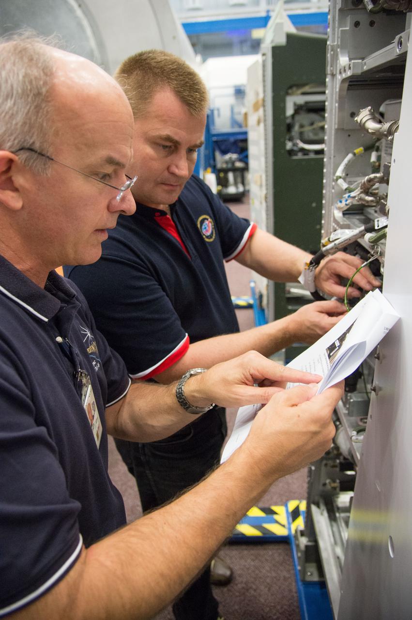DATE: 9-24-14 LOCATION: Bldg. 9NW - ISS Mockups. SUBJECT: Expedition 48 crew members (Soyuz 46) Aleksey Ovchinin, Oleg Skripochka and Jeff Williams during Routine Ops training in Space Vehicle Mockup Training Facilities (SVMTF) ISS mockups with instructor John Ray. PHOTOGRAPHER: Lauren Harnett