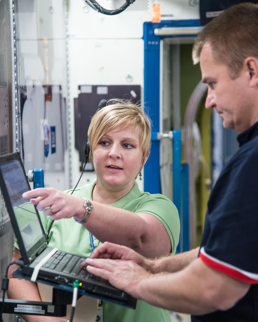 DATE: 9-24-14 LOCATION: Bldg. 9NW - ISS Mockups. SUBJECT: Expedition 48 crew members (Soyuz 46) Aleksey Ovchinin, Oleg Skripochka and Jeff Williams during Routine Ops training in Space Vehicle Mockup Training Facilities (SVMTF) ISS mockups with instructor John Ray. PHOTOGRAPHER: Lauren Harnett