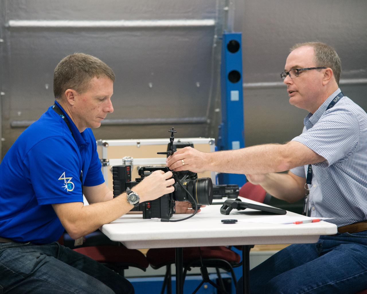 PHOTO DATE: 09-26-14 LOCATION: Bldg. 9NW - ISS Mockups SUBJECT: Expedition 43 crew member Terry Virts during Red Dragon cinema camera training with instructor Mark Turner. PHOTOGRAPHER: BILL STAFFORD