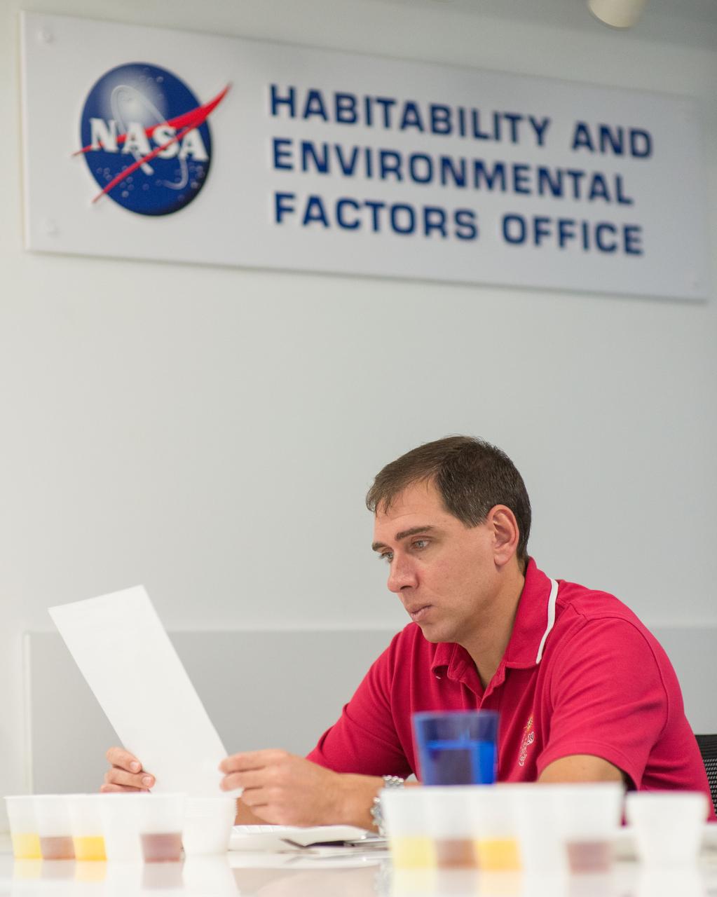 PHOTO DATE: 9-26-14 LOCATION: Bldg. 17, Room 1070 - Food Lab. SUBJECT: Expedition 45 and Soyuz 44 cosmonaut Sergei Volkov with Yuri Malenchenko during Food Tasting in JSC Food Lab. PHOTOGRAPHER: Lauren Harnett