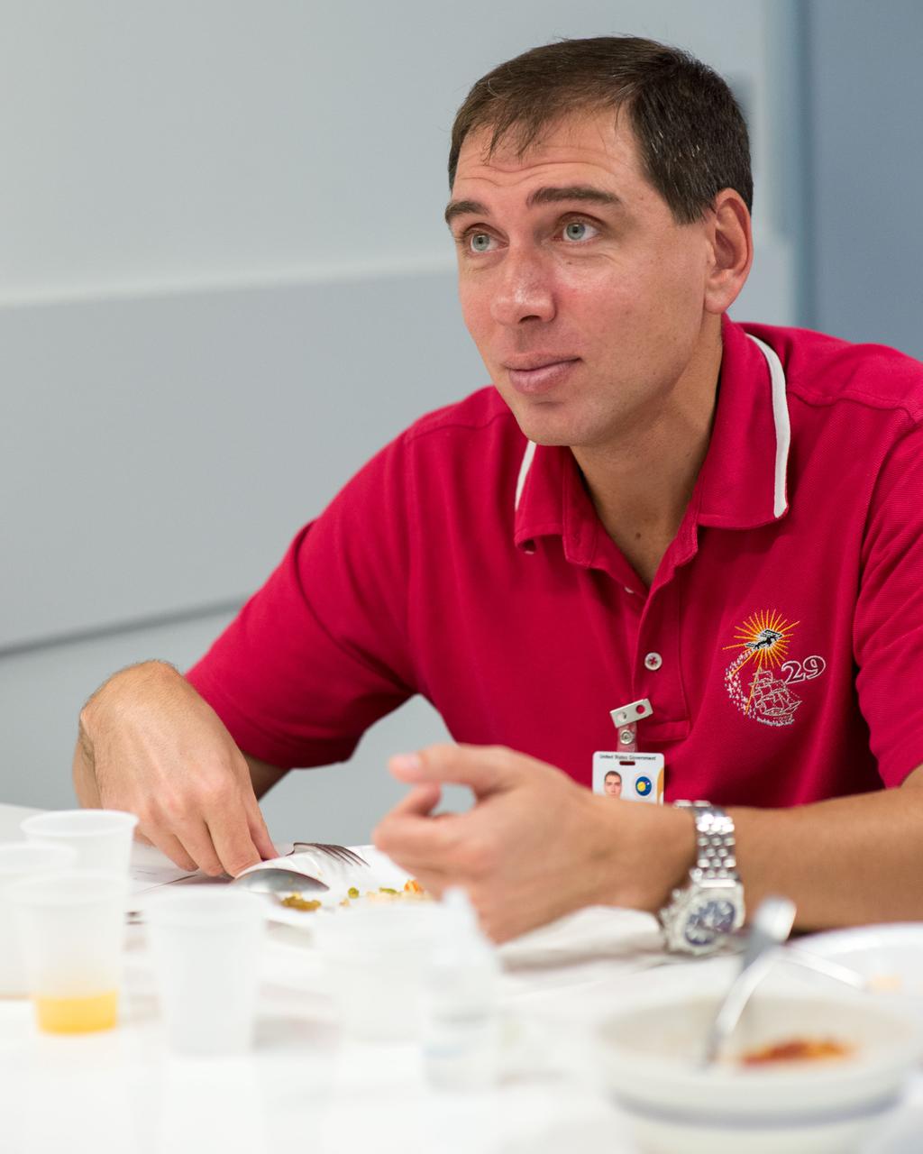PHOTO DATE: 9-26-14 LOCATION: Bldg. 17, Room 1070 - Food Lab. SUBJECT: Expedition 45 and Soyuz 44 cosmonaut Sergei Volkov with Yuri Malenchenko during Food Tasting in JSC Food Lab. PHOTOGRAPHER: Lauren Harnett