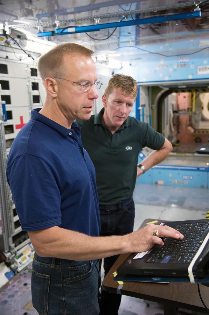 Date: 09-30-14 Location: Bldg 9NW, ISS Mockup Subject: Expedition 46/47 (Soyuz 45) crew members Tim Kopra, Timothy Peake, Yuri Malenchenko with instructor Wyatt Smith during Routine Ops training in the Space Vehicle Mockup Training Facility's ISS mockups Photographer: James Blair