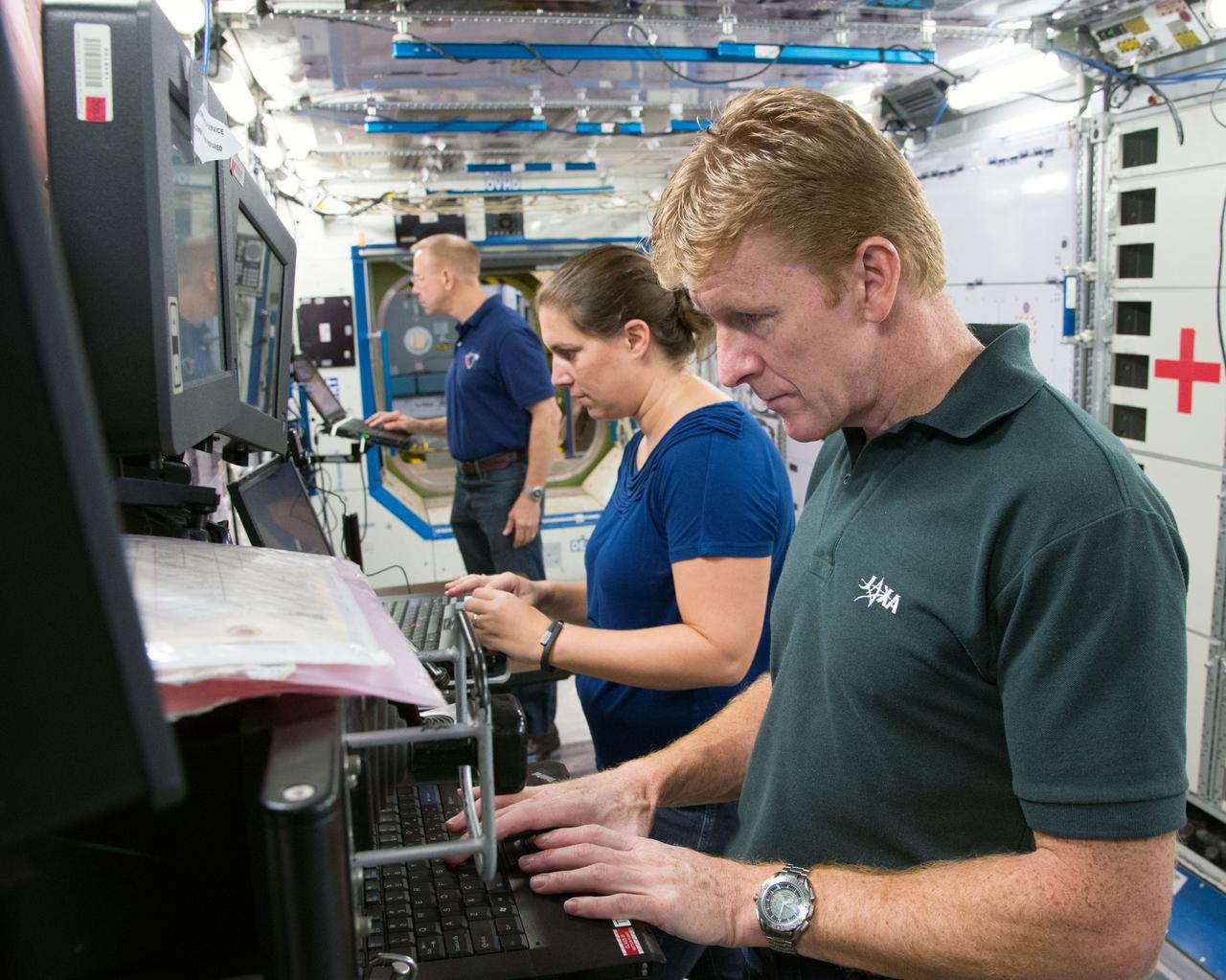 Date: 09-30-14 Location: Bldg 9NW, ISS Mockup Subject: Expedition 46/47 (Soyuz 45) crew members Tim Kopra, Timothy Peake, Yuri Malenchenko with instructor Wyatt Smith during Routine Ops training in the Space Vehicle Mockup Training Facility's ISS mockups Photographer: James Blair