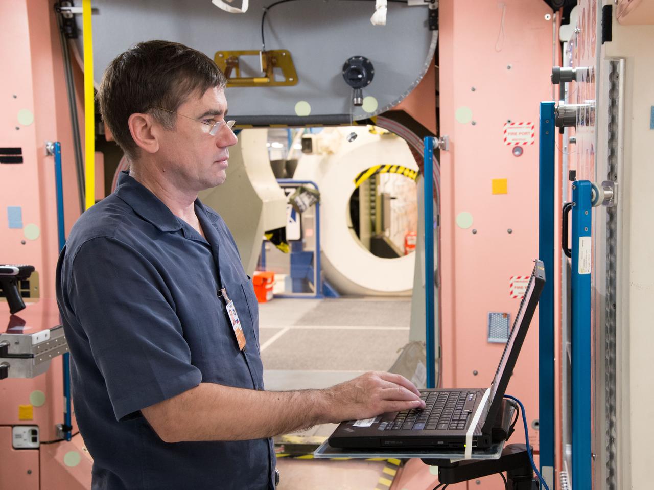 Date: 09-30-14 Location: Bldg 9NW, ISS Mockup Subject: Expedition 46/47 (Soyuz 45) crew members Tim Kopra, Timothy Peake, Yuri Malenchenko with instructor Wyatt Smith during Routine Ops training in the Space Vehicle Mockup Training Facility's ISS mockups Photographer: James Blair