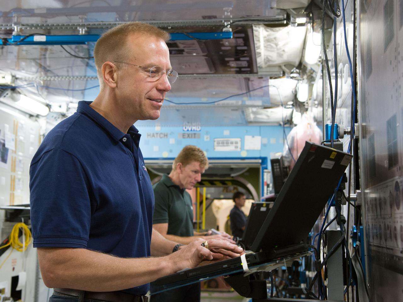 Date: 09-30-14 Location: Bldg 9NW, ISS Mockup Subject: Expedition 46/47 (Soyuz 45) crew members Tim Kopra, Timothy Peake, Yuri Malenchenko with instructor Wyatt Smith during Routine Ops training in the Space Vehicle Mockup Training Facility's ISS mockups Photographer: James Blair