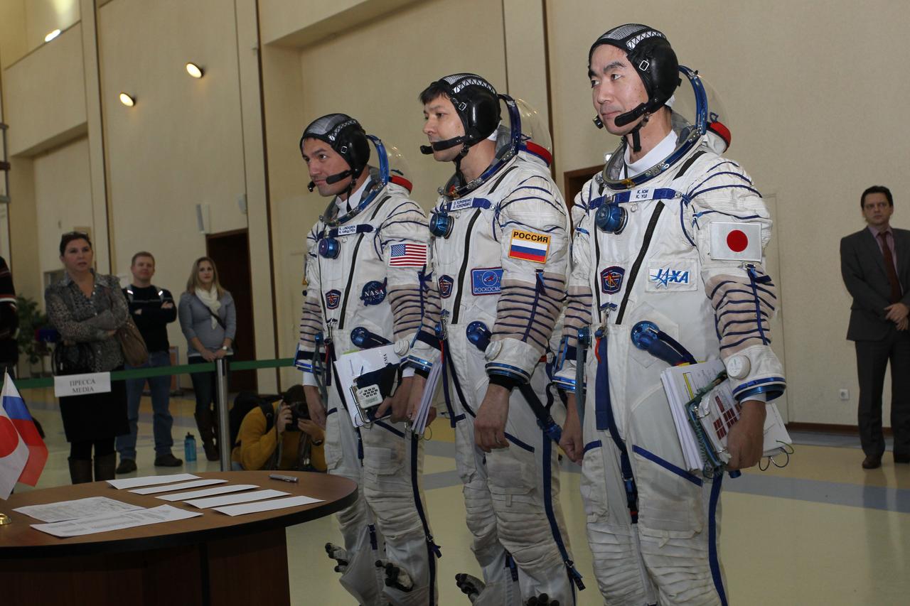 #3179 - (30 October 2014) --- At the Gagarin Cosmonaut Training Center in Star City, Russia, Expedition 42/43 backup crewmembers Kjell Lindgren of NASA (left), Soyuz Commander Oleg Kononenko of the Russian Federal Space Agency (Roscosmos, center) and Kimiya Yui of the Japan Aerospace Exploration Agency (right) prepare to sign in for their final Soyuz qualification exams October 30. They are the backups to the prime crew --- Terry Virts of NASA, Anton Shkaplerov of Roscosmos and Samantha Cristoforetti of the European Space Agency --- who are in the final stages of training for launch November 24, Kazakh time, in the Soyuz TMA-15M spacecraft to begin a five and a half month mission on the International Space Station. Photo credit: NASA/Stephanie Stoll 